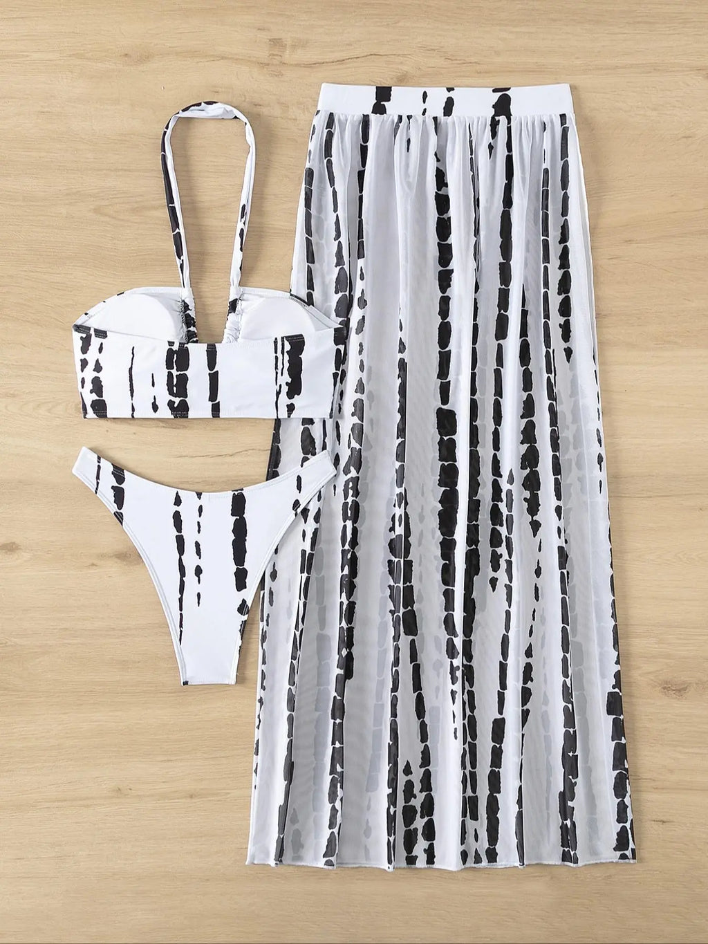 Three-Piece Women's Tie Dye Criss Cross Swimsuit Set with Halter Neck Swim Bra, Split Thigh Cover-Up Skirt, and High Cut Swim Panty for Summer Beach Wear